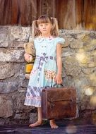 a child with suitcase