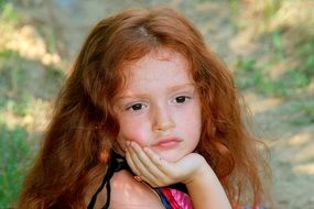 portrait of a beautiful girl with red hair