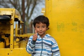 child showing thumb up gesture