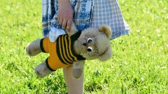 girl holding teddy bear