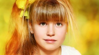 portrait of blond girl face in the soft light