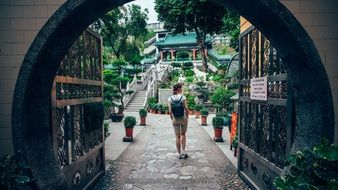 girl in the temple garden in Hong Kong