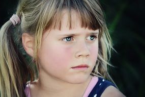 portrait of a serious blond girl