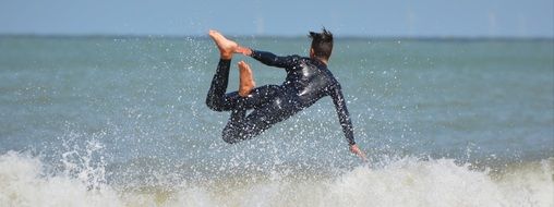 surfer falling in the waves