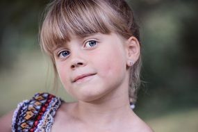 blond girl with forelock