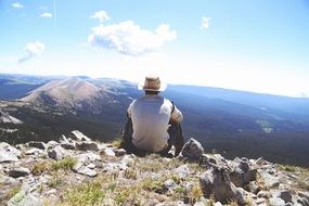 make hiker watching mountains