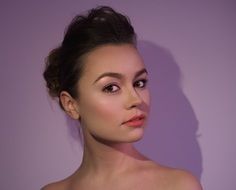 portrait of a girl near the pink wall