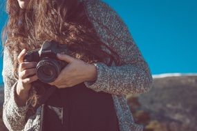 girl with a camera canon close-up