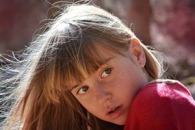 portrait of young girl with long blond hair