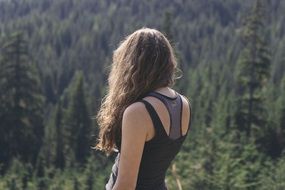 woman with long hair in forest