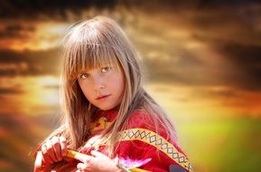 photo of the girl in an Indian costume at sunset