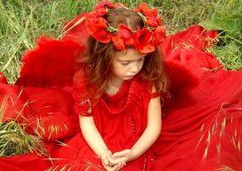 photo sad girl in a red dress