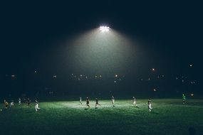 football players on the field at night