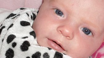 newborn in spotty costume