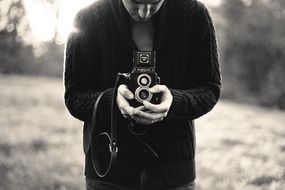 black and white photo of a photographer among nature
