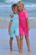 Photo of best friends resting on a beach