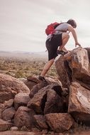 teen climbs big rocks