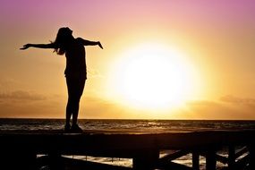 photo of the woman at the sunrise