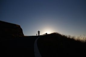 silhouette of a person at sunset