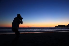 photographer snapping sunset