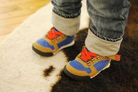 sportive shoes on child boyâs feet