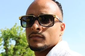 portrait of a man in sunglasses in the summer
