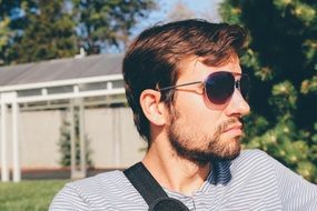 young man with beard in sunglasses
