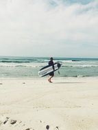 surfer on the incredibly beautiful beach