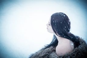 glamour lady in fur at snowy day