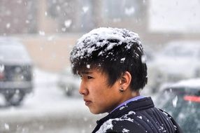 A man on the street during heavy snow