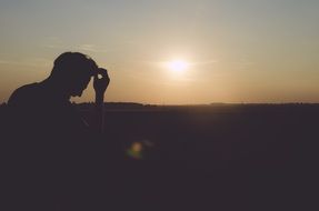 silhouette of the man at the sunrise