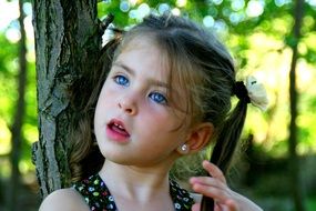 Portrait of the beauty Child in a forest
