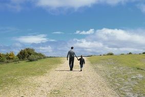 family father and son walking