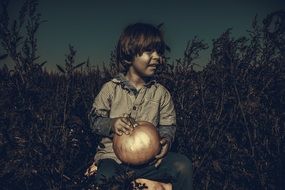 boy taking pumpkin thanksgiving