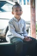 boy sitting on a bench