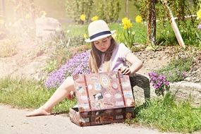 girl with a suitcase on the road