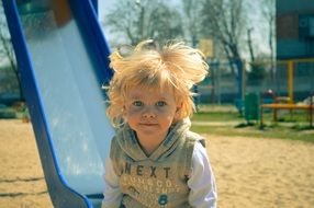 blonde boy on playground