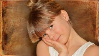 view of child girl face blond hair