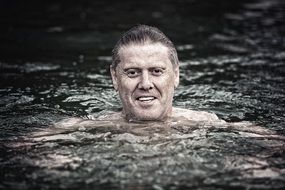 man in the natural bathing lake