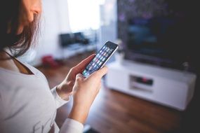 woman with iphone in hands