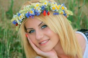 beautiful blonde girl with colorful flower wreath