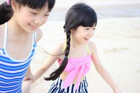 happy girls on the beach