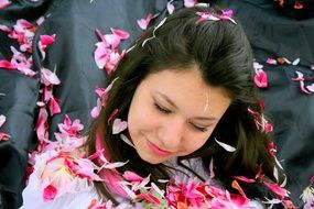 beauty girls strewn with pink petals