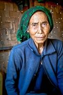 elderly Vietnamese woman in green headscarf