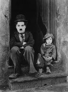 Black and white photo of charlie chaplin and girl