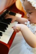 baby playing piano