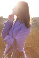 beautiful girl on a background of the spring sun