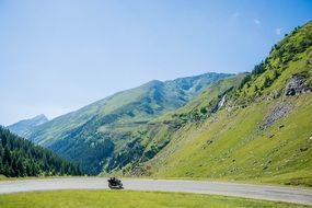 motorcycle ride by road mountain scene