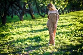 romantic young woman on the meadow