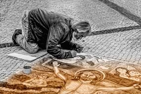 man artist painting the stone land